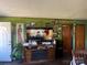 Cozy living room featuring green walls, and a decorated entertainment center at 739 Owls Den Rd, Lincolnton, NC 28092