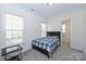 Cozy bedroom featuring carpet floors, natural light, and neutral decor at 809 Brown Creek Dr, Matthews, NC 28104