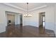Stylish dining room boasts hardwood floors and modern lighting at 809 Brown Creek Dr, Matthews, NC 28104