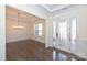 Formal dining room featuring hardwood floors, wainscoting, and a modern chandelier at 809 Brown Creek Dr, Matthews, NC 28104