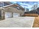 Exterior showing brick, garage, and paved driveway with wood privacy fence at 809 Brown Creek Dr, Matthews, NC 28104