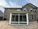 Brick home featuring a sunroom addition, enhanced by a brick paver patio at 809 Brown Creek Dr, Matthews, NC 28104