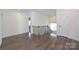 Bright hallway with hardwood flooring, neutral walls, and a decorative railing overlooking the staircase at 809 Brown Creek Dr, Matthews, NC 28104