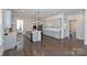 Large open concept kitchen with center island, stainless appliances, and hardwood floors at 809 Brown Creek Dr, Matthews, NC 28104