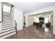 Inviting living room featuring hardwood floors and a cozy fireplace at 809 Brown Creek Dr, Matthews, NC 28104