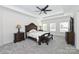 Spacious main bedroom features a tray ceiling, carpet, and a large bed flanked by matching nightstands at 809 Brown Creek Dr, Matthews, NC 28104