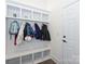 Mudroom with built-in bench, cubbies, and coat hooks offering organized entry at 809 Brown Creek Dr, Matthews, NC 28104