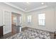 Spacious home office with french doors, tray ceiling and view to another room at 809 Brown Creek Dr, Matthews, NC 28104