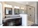 Modern bathroom with granite countertops, dark wood cabinets, double vanity, and glass enclosed shower at 9521 Ainslie Downs St, Charlotte, NC 28273