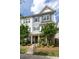 Attractive townhome with a stone facade, gray shutters, and well-maintained landscaping, offering curb appeal at 9521 Ainslie Downs St, Charlotte, NC 28273