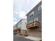 Townhome showing exterior garages and private decks in a row along the back of the homes at 9521 Ainslie Downs St, Charlotte, NC 28273