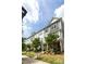 Charming townhome exterior featuring stone accents, manicured landscaping, and inviting curb appeal at 9521 Ainslie Downs St, Charlotte, NC 28273