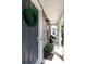 Inviting front porch with stone accents, a wreath on the front door, and cozy seating, creating a welcoming entrance at 9521 Ainslie Downs St, Charlotte, NC 28273