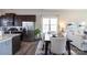 Well-equipped kitchen featuring stainless steel appliances, dark cabinets, and an eat-in kitchen layout at 9521 Ainslie Downs St, Charlotte, NC 28273