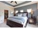 Main bedroom featuring tray ceilings, a ceiling fan, and a walk-in closet at 9521 Ainslie Downs St, Charlotte, NC 28273