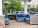 Relaxing outdoor seating area with comfortable blue cushions and a heater at 9521 Ainslie Downs St, Charlotte, NC 28273