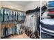 Well-organized walk-in closet with ample shelving and hanging space for clothes, shoes, and accessories at 9521 Ainslie Downs St, Charlotte, NC 28273