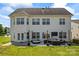 Large backyard featuring a patio with outdoor furniture, perfect for entertaining and enjoying the outdoors at 9639 Ravenscroft Nw Ln, Concord, NC 28027