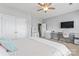Bedroom with a ceiling fan, plush carpeting, and dedicated desk and closet areas at 9639 Ravenscroft Nw Ln, Concord, NC 28027