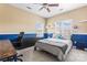Cozy bedroom with an accent wall, large window, and desk for studying at 9639 Ravenscroft Nw Ln, Concord, NC 28027