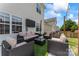 Outdoor patio area with comfortable seating and stylish decor, creating an inviting space for relaxation and entertainment at 9639 Ravenscroft Nw Ln, Concord, NC 28027