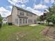 A view of the back of this house that has a fenced in back yard at 9700 Ravenscroft Nw Ln, Concord, NC 28027