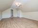 Spacious bedroom features a ceiling fan, natural light, and access to another room at 9700 Ravenscroft Nw Ln, Concord, NC 28027