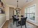 Elegant dining room with modern chandelier and stylish decor at 9700 Ravenscroft Nw Ln, Concord, NC 28027
