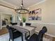 Tastefully decorated dining room with elegant chandelier and artwork at 9700 Ravenscroft Nw Ln, Concord, NC 28027