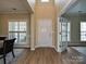 Welcoming foyer with wood floors and a view into the dining area at 9700 Ravenscroft Nw Ln, Concord, NC 28027