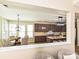 Open-concept kitchen and dining area featuring stainless steel appliances and natural light from large windows at 9700 Ravenscroft Nw Ln, Concord, NC 28027