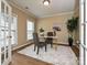 Cozy home office with wood floors, natural light, and a stylish desk setup at 9700 Ravenscroft Nw Ln, Concord, NC 28027