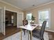 Comfortable home office space with wood floors and large windows at 9700 Ravenscroft Nw Ln, Concord, NC 28027