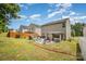 The property has a sizable backyard with a patio, grill, and privacy fence, perfect for outdoor activities at 9718 Eagle Feathers Dr, Charlotte, NC 28214