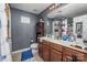 Bathroom featuring double sink vanity with granite countertop and cabinet space at 9718 Eagle Feathers Dr, Charlotte, NC 28214