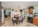 Charming dining area adjacent to the kitchen with table and sliding glass door at 9718 Eagle Feathers Dr, Charlotte, NC 28214