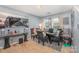 Comfortable dining room featuring modern table setting and neutral colored walls at 9718 Eagle Feathers Dr, Charlotte, NC 28214