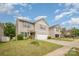 Well-manicured lawn leads up to this two-story home with attached garage at 9718 Eagle Feathers Dr, Charlotte, NC 28214