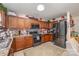 Bright kitchen boasts stainless steel appliances, tiled countertops, and ample cabinet space at 9718 Eagle Feathers Dr, Charlotte, NC 28214