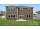 Spacious backyard features a well-maintained lawn and a two-story home at 9952 Manor Vista Trl, Kannapolis, NC 28027