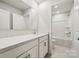 Clean bathroom with white cabinets, quartz countertop, and a tub shower at 9952 Manor Vista Trl, Kannapolis, NC 28027
