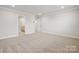 Bright bedroom features plush carpet and multiple doors at 9952 Manor Vista Trl, Kannapolis, NC 28027