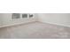 Bright bedroom features plush carpet and natural light at 9952 Manor Vista Trl, Kannapolis, NC 28027