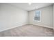 Bedroom featuring plush carpet, white painted walls, and a double-hung window at 9952 Manor Vista Trl, Kannapolis, NC 28027