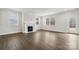 Inviting living room features a fireplace, hardwood floors, and large windows at 9952 Manor Vista Trl, Kannapolis, NC 28027