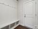 Mudroom features a built-in bench with storage, coat hooks, and door to the exterior at 9952 Manor Vista Trl, Kannapolis, NC 28027