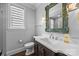 Updated bathroom featuring a modern vanity with a decorative mirror at 1012 N Sharon Amity Rd, Charlotte, NC 28211