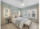 Bedroom featuring a large bed, bench, and a 