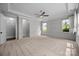 Bright bedroom with decorative trim, ceiling fan and ensuite bathroom at 1012 N Sharon Amity Rd, Charlotte, NC 28211