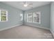 This spacious bedroom features neutral paint, carpet and lots of natural light at 1012 N Sharon Amity Rd, Charlotte, NC 28211